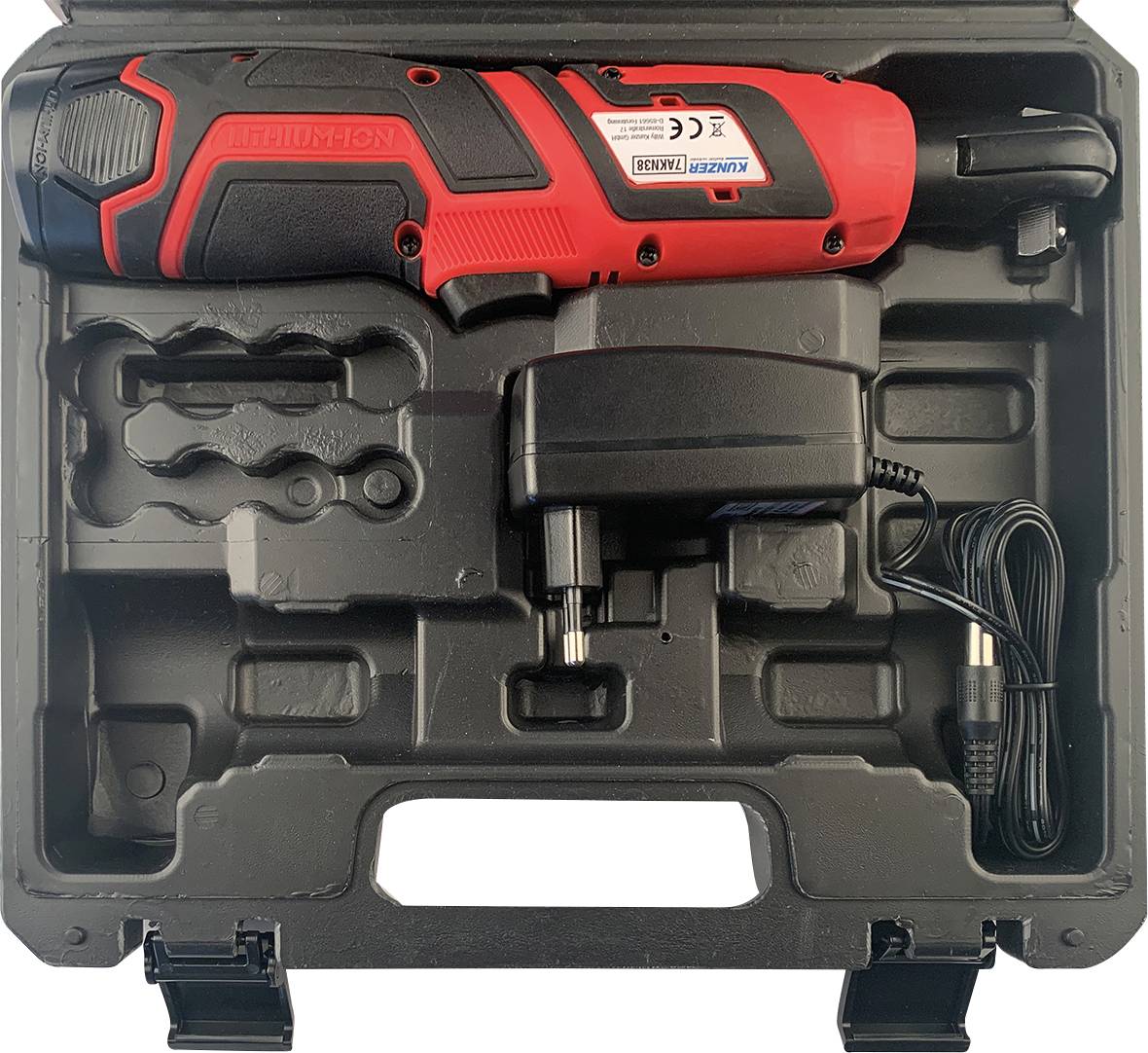 Un tournevis à percussion sans fil rouge avec chargeur dans un coffret en plastique noir.