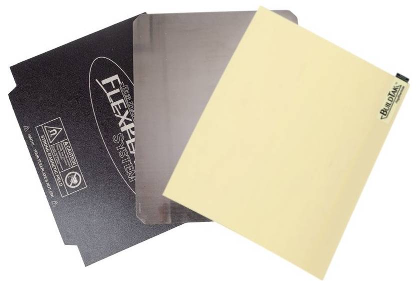 Trois surfaces d'impression FlexPlate différentes se chevauchent partiellement, chacune avec une texture et une couleur distinctes.