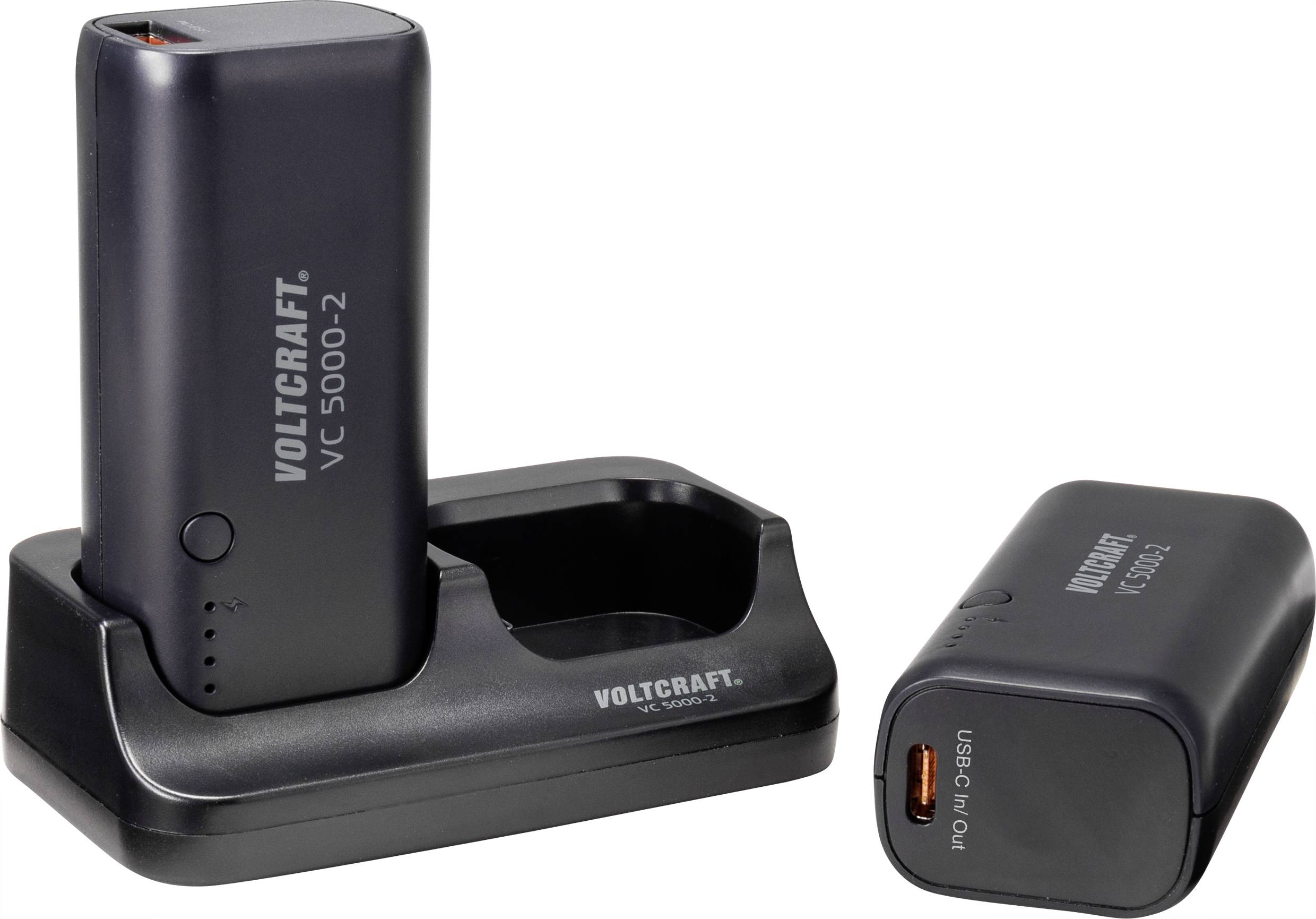Deux chargeurs noirs Voltcraft, modèle VC 5000-2. L'un est dressé dans la station de charge, l'autre est posé à côté.