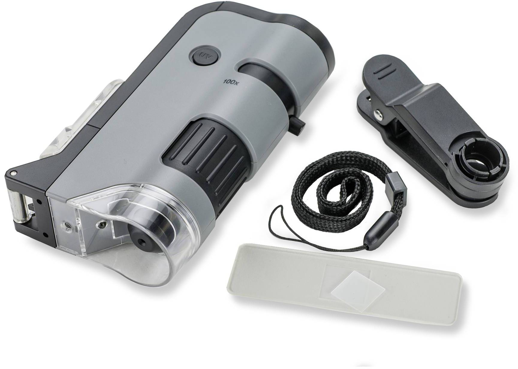 Microscope portable avec boîtier gris, zone d'objectif noir. Accessoires : porte-objets, protection de lentille et sangle.