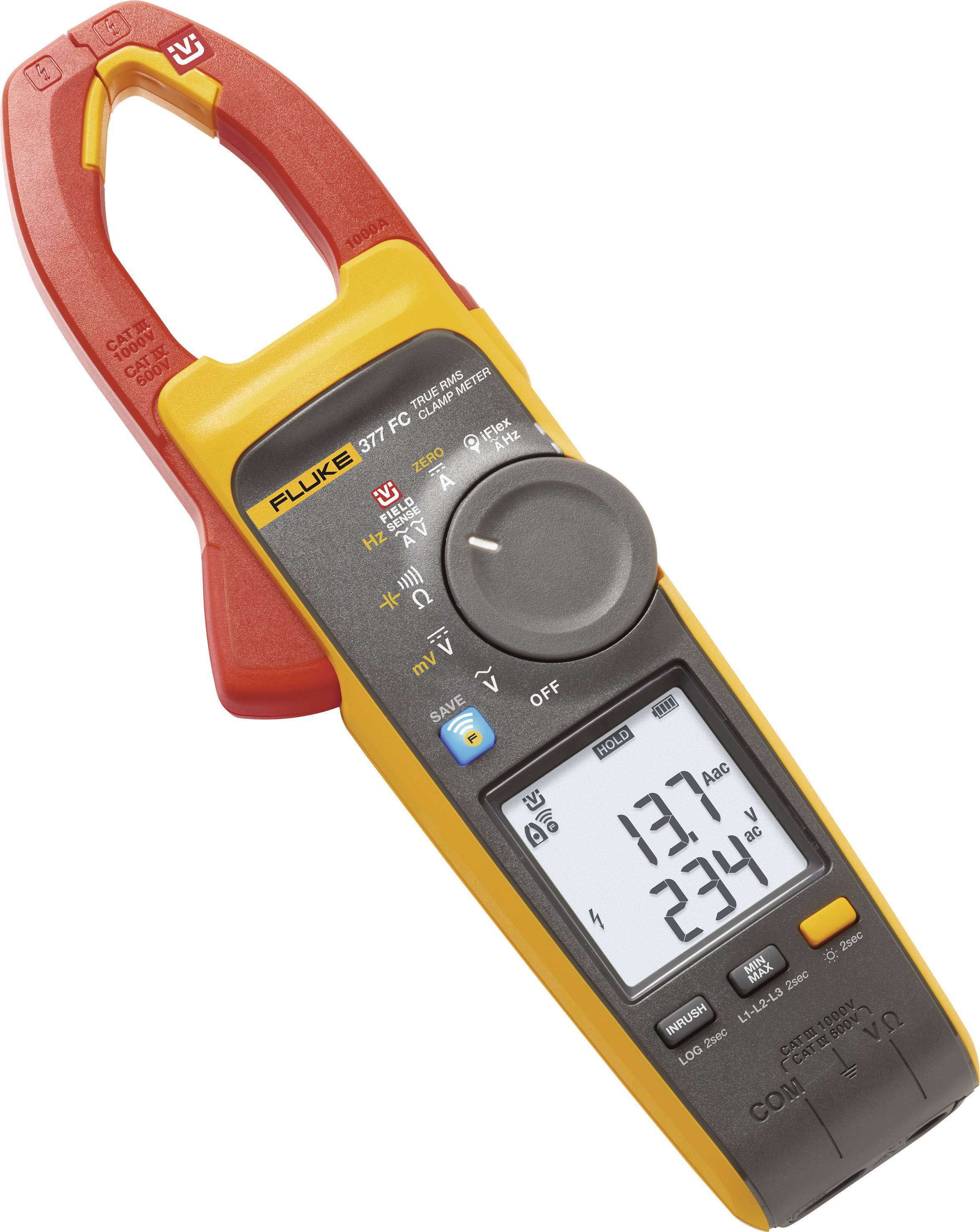 Un multimètre à pince ampèremétrique Fluke jaune et rouge affiche '137 A' et '234 V' sur son écran.