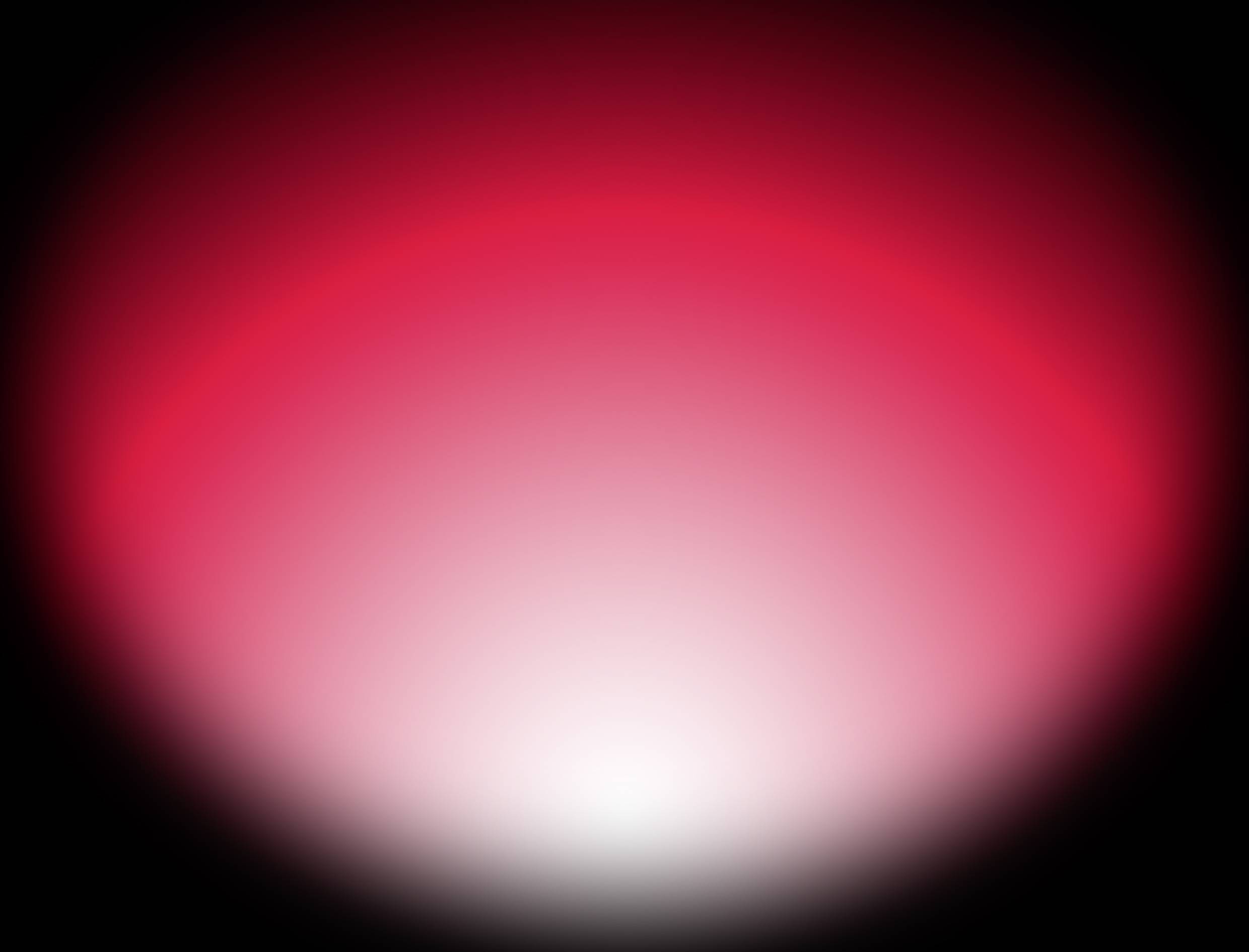 Un éclat lumineux dégradé rouge et blanc, intensifié au centre et s'assombrissant vers l'extérieur, sur un fond noir.