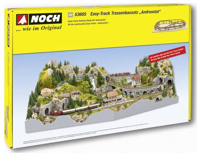 Model railway layout kit 'Easy-Track Andreastal' includes tracks, landscapes, and a bridge in a scenic mountain setting.