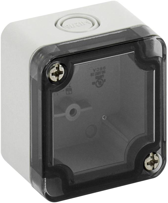 Prise électrique blanche, carrée, avec un couvercle transparent et deux vis visibles dans les coins supérieurs.