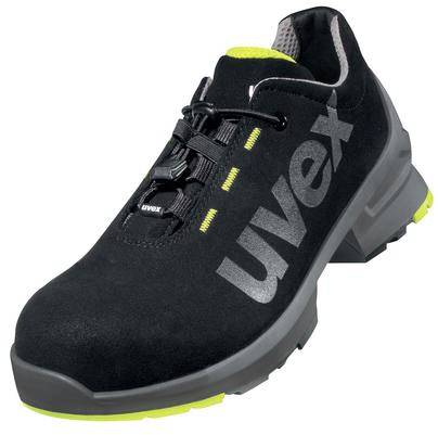Une chaussure de sécurité noire avec semelle grise et accents jaunes, portant la mention 'uvex' sur le côté.