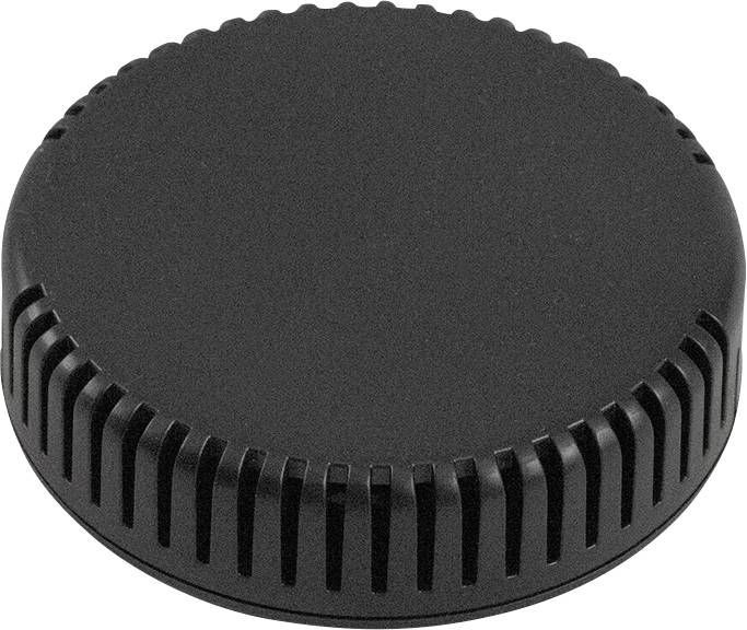 Couvercle noir, rond, à bord dentelé.