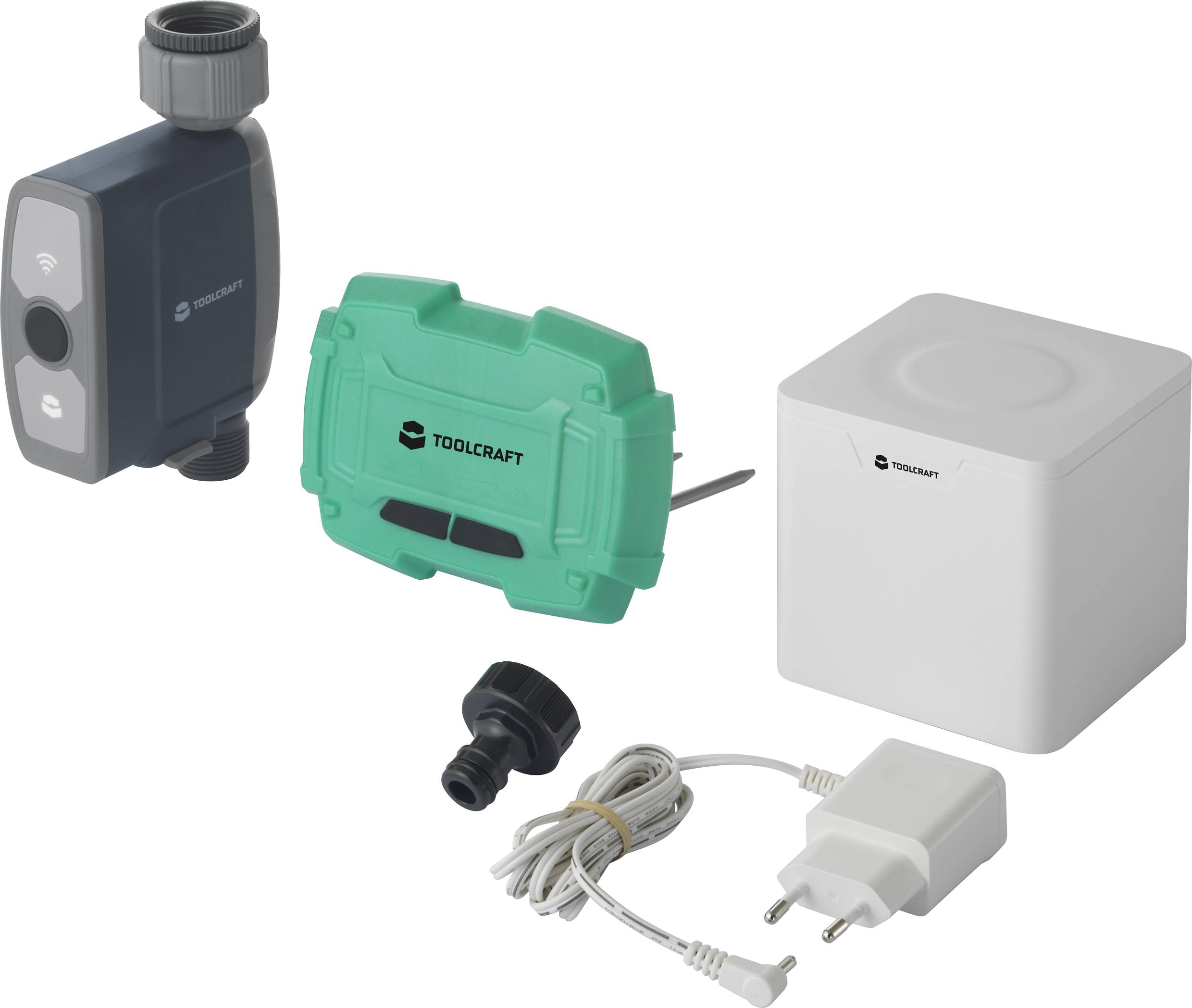 Un système d'irrigation avec une vanne, un boîtier de commande, un bloc d'alimentation et un adaptateur. Marque TOOLCRAFT. Idéal pour l'automatisation du jardin.