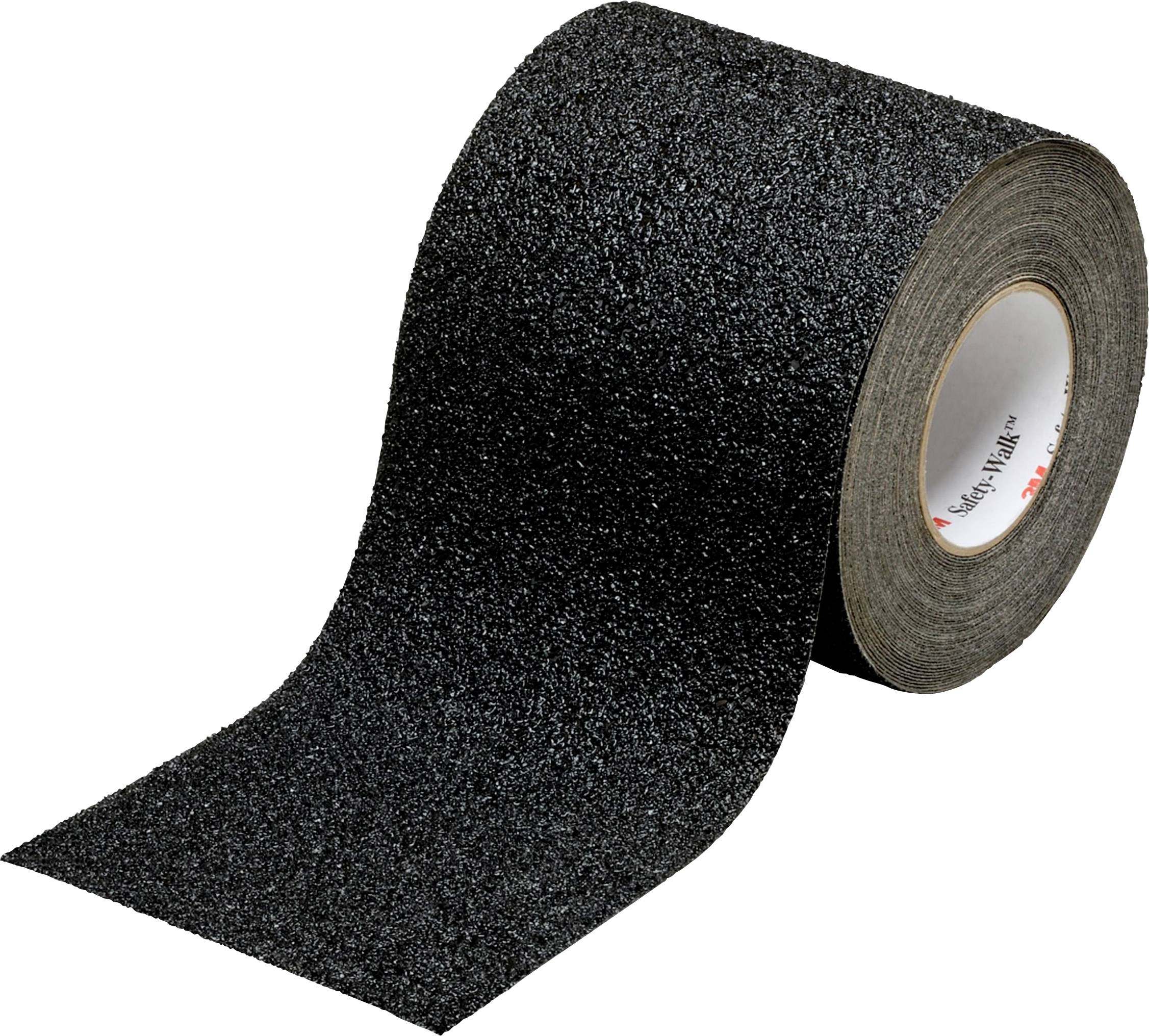 Un rouleau de ruban antidérapant noir à grain grossier, utilisé pour augmenter l'adhérence sur des surfaces lisses.