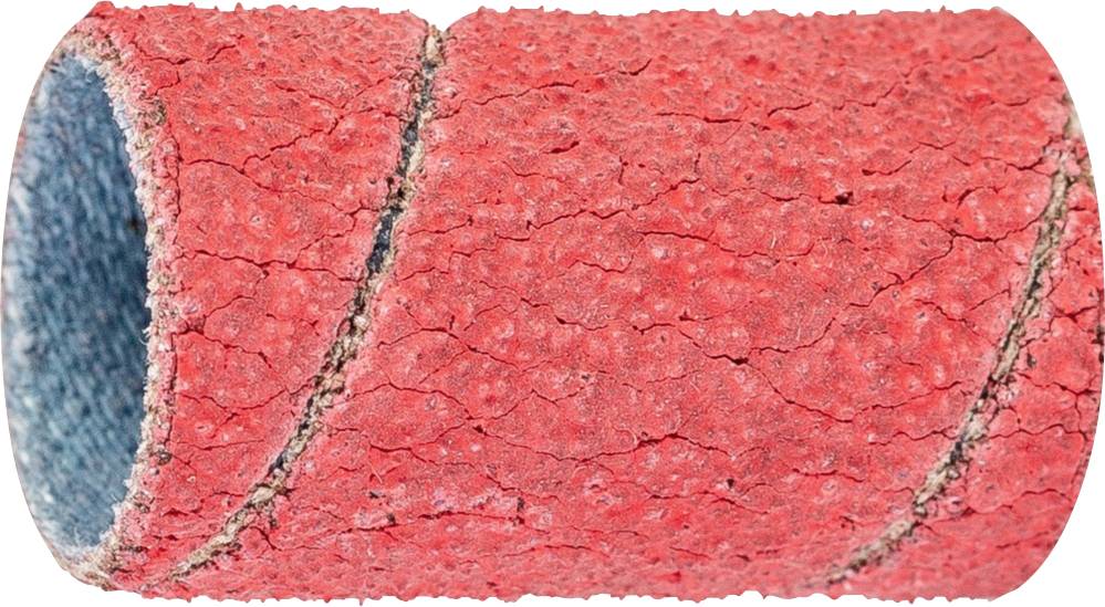 Gros plan d'un cylindre rouge et rugueux avec une surface écorchée. Le cylindre présente une couture en spirale.