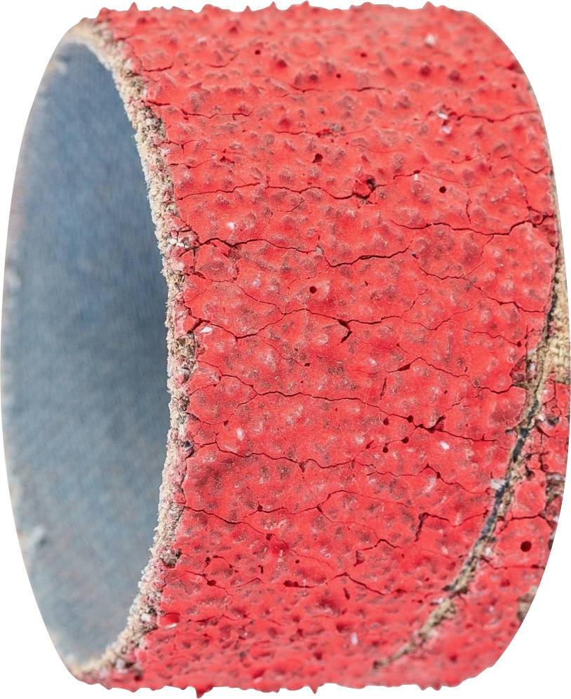 Manchon abrasif rouge avec un grain grossier, visiblement usé, probablement utilisé pour des travaux de ponçage.