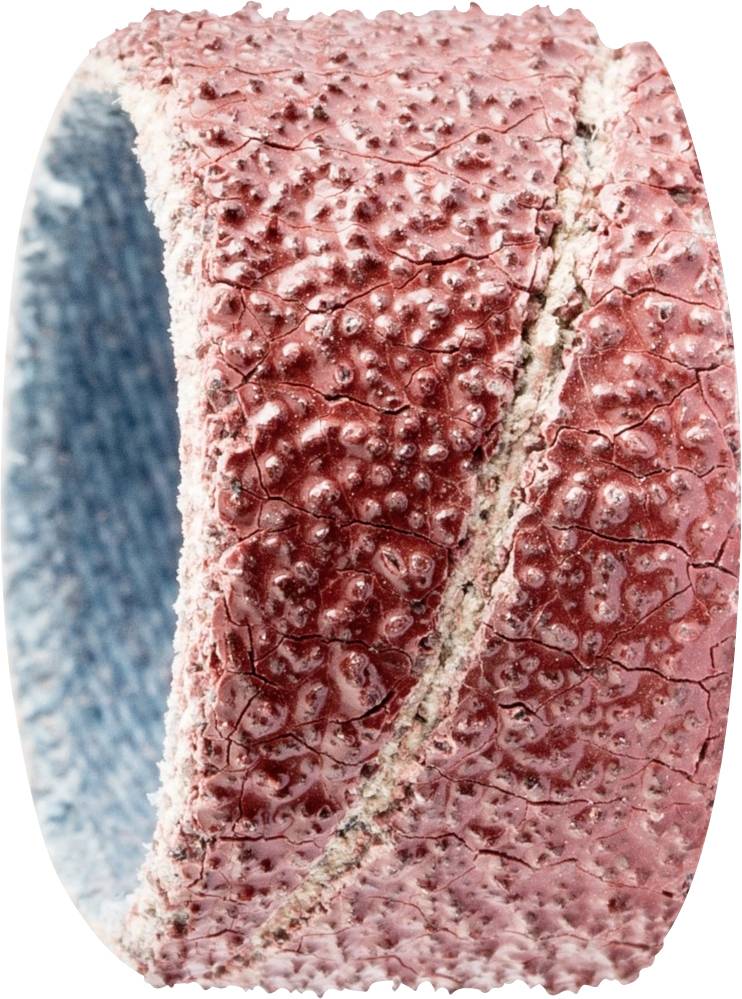 Un objet rond et rouge à structure texturée avec une surface rugueuse, à côté d'une surface intérieure lisse et bleue. Probablement un anneau décoratif.