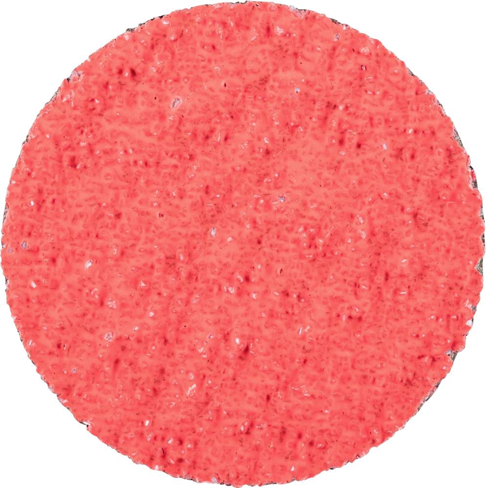 Une éponge ronde rouge à la texture irrégulière.