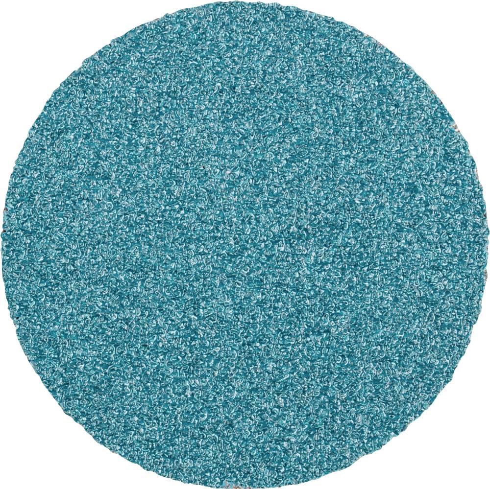 Un disque abrasif rond de couleur turquoise, à grain uniforme, est utilisé pour les travaux de ponçage.
