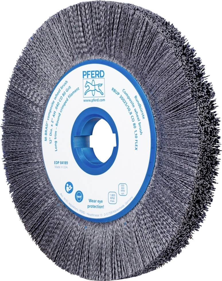 Brosse métallique ronde avec embout en plastique, bleu et grise. Étiquette au centre avec les informations du fabricant et la consigne de sécurité 'Porter une protection oculaire'.