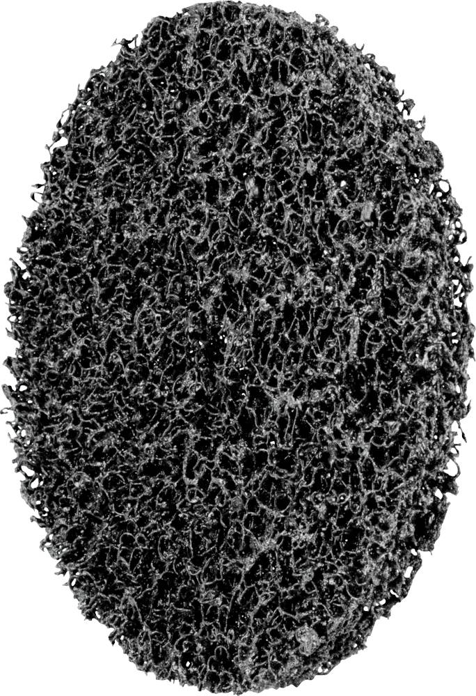 Une éponge de récurage ovale, noire, avec une texture rugueuse et poreuse. Idéale pour nettoyer les salissures tenaces.