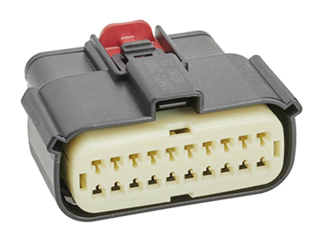 Connecteur électrique noir avec un noyau jaune. Design rectangulaire, comportant de nombreux petits contacts pour des câblages complexes.