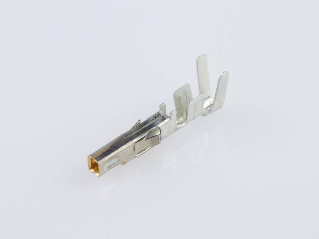 Pince métallique sur fond blanc, avec deux dents parallèles et un contact en cuivre, probablement utilisée pour des connexions électriques.