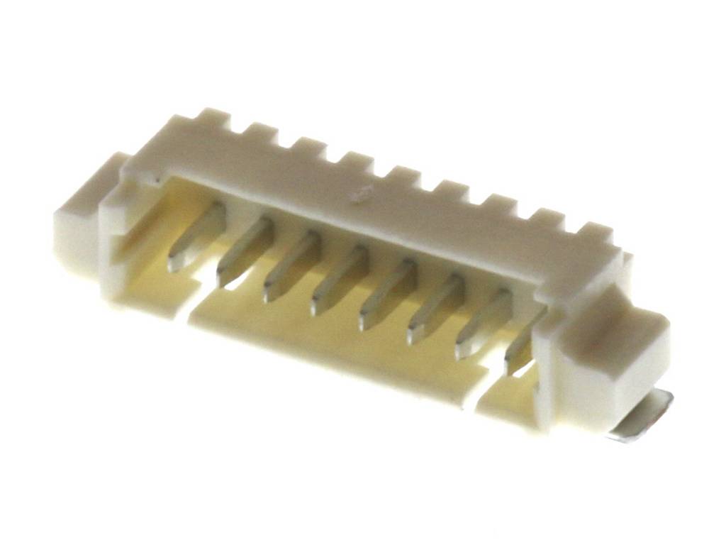 Un connecteur blanc à six broches avec des broches métalliques, utilisé pour les connexions électroniques sur les circuits imprimés.