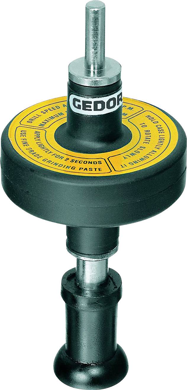 Un outil de surfaçage de siège de soupape avec poignée, utilisé pour l'usinage des surfaces de sièges de soupapes. Marquage « Gedore » et instructions d'utilisation.