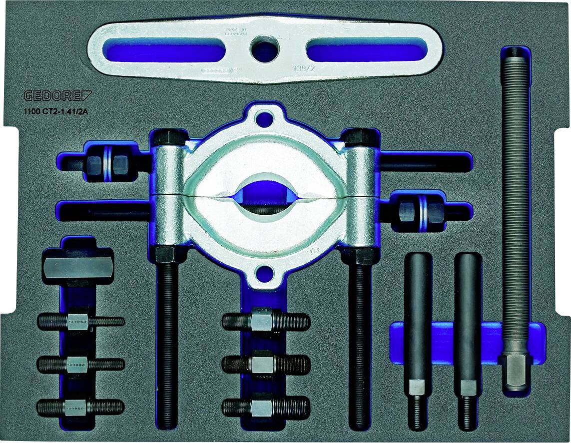 Un ensemble d'extracteurs de roulement avec garniture en mousse : Comprend des vis de traction, des entretoises, une plaque d'extraction et des vis. Outils organisés.