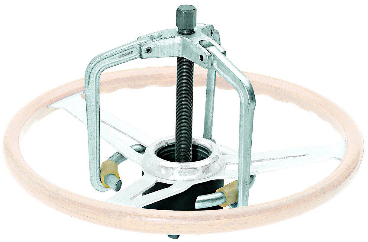 Un extracteur mécanique avec un axe central denté et trois bras, spécialement conçu pour le démontage des volants de direction.