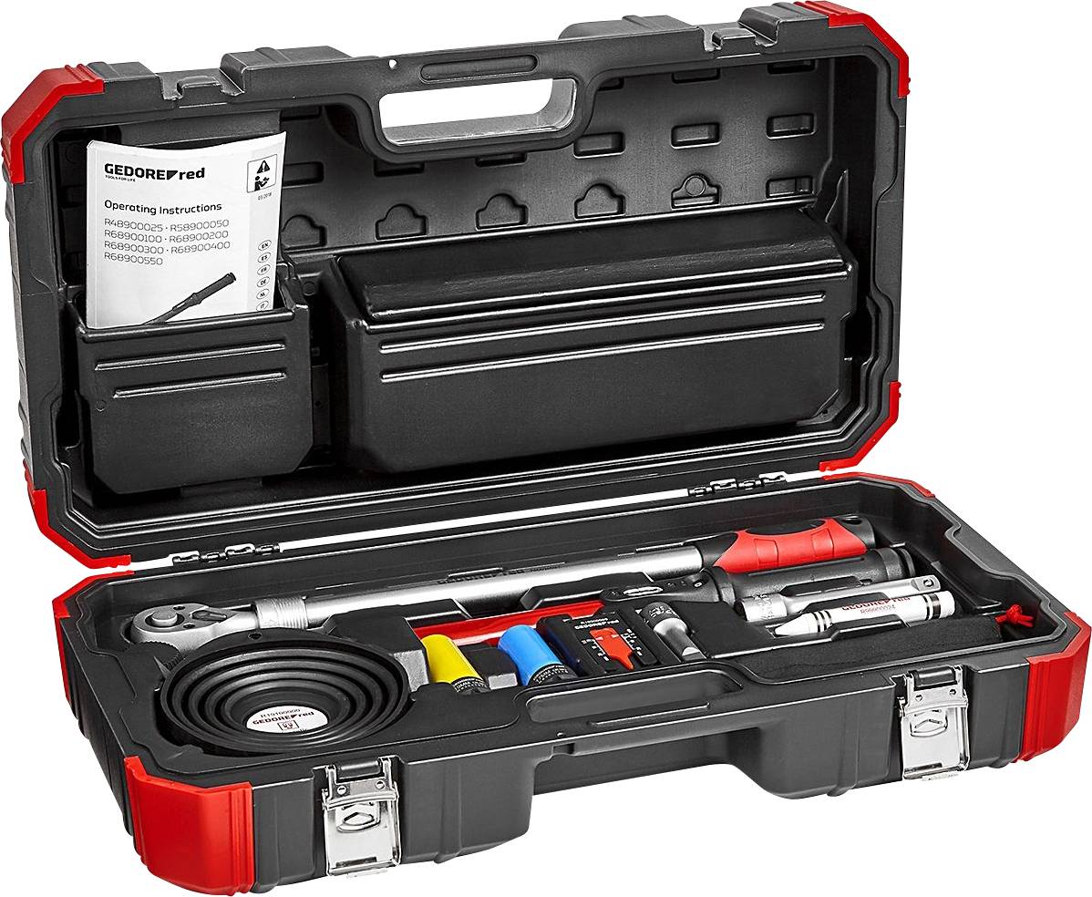 Mallette à outils avec couvercle ouvert, montrant divers outils tels qu'une clé à cliquet, des rallonges et le mode d'emploi à l'intérieur du couvercle.