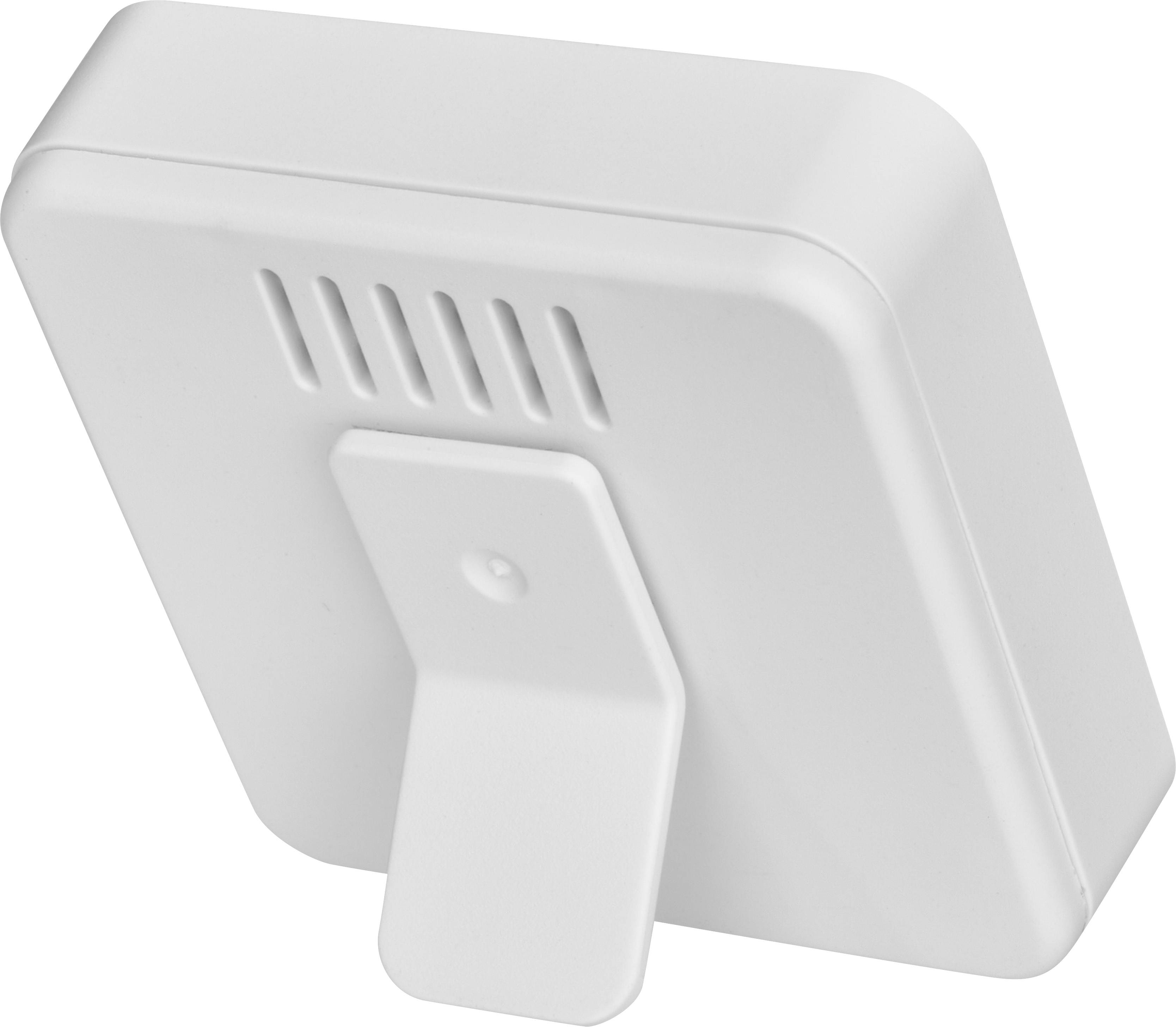 Un appareil blanc rectangulaire avec un support, probablement un instrument de mesure électronique ou un capteur, sur un fond blanc.