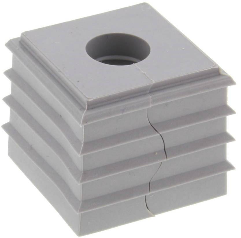 Pièce en plastique grise, carrée, comportant plusieurs rainures horizontales et un trou central rond. Utilisée pour le passage des câbles.