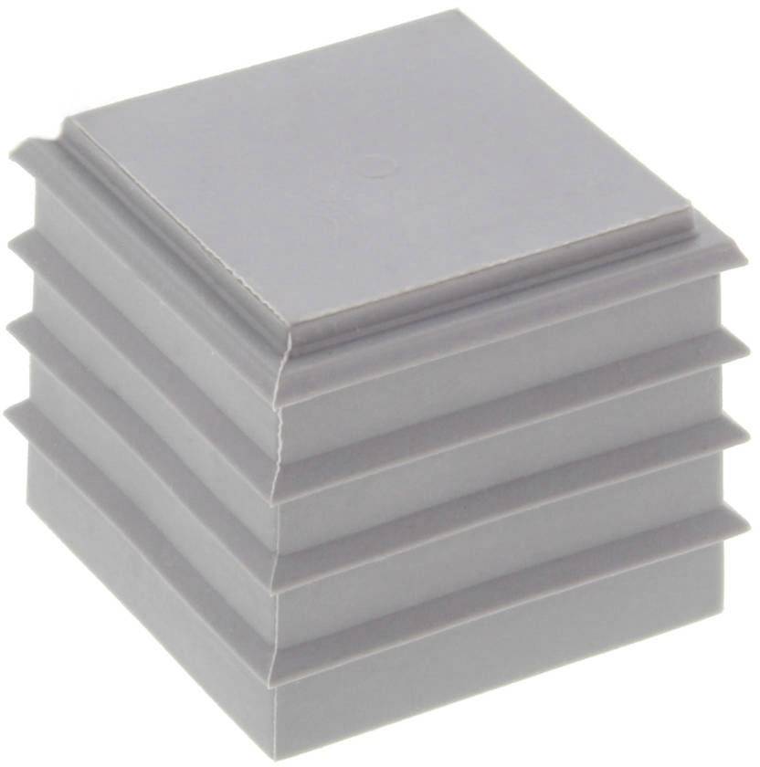 Un carré en plastique gris avec des bords empilés et saillants, ressemblant à une petite boîte stratifiée.