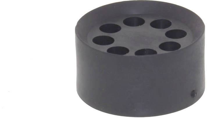 Tampon de caoutchouc noir rond avec huit cavités circulaires sur la surface supérieure ; utilisé pour amortir les vibrations ou stabiliser des objets.