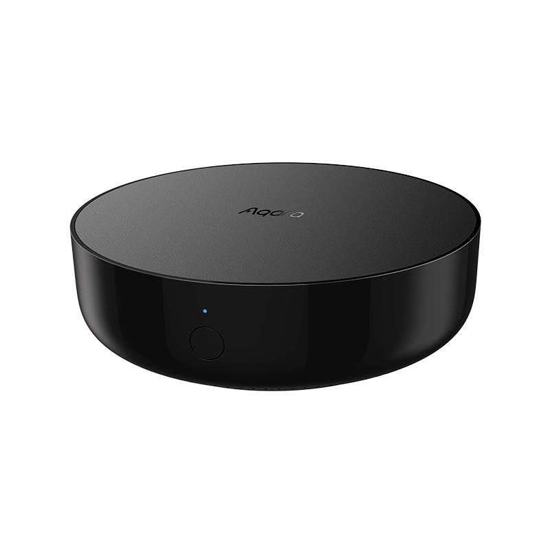 Pont Smart Home noir, rond et plat, doté d'un petit bouton, adapté pour connecter différents appareils domotiques.