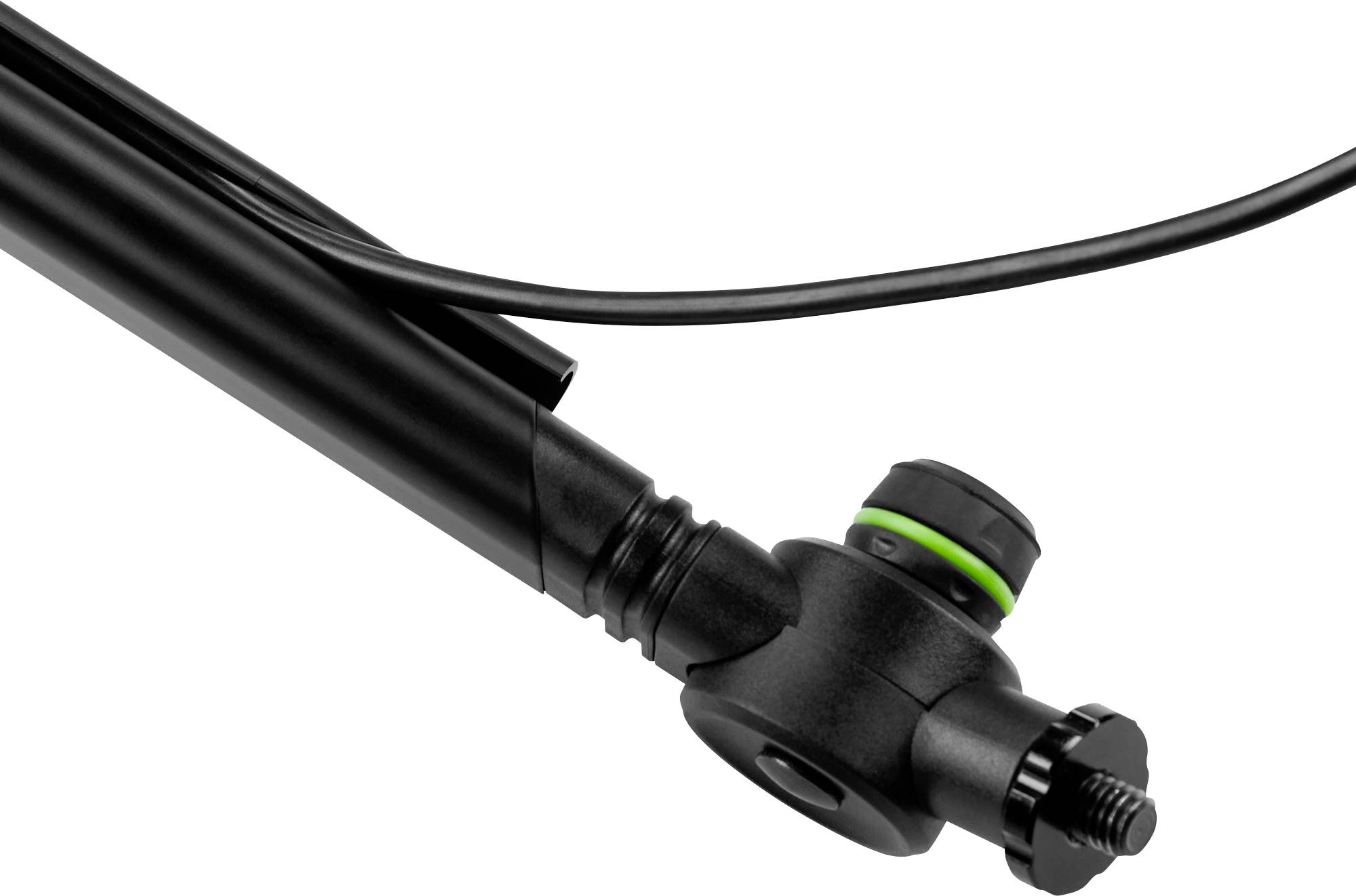 Une valve de vélo noire avec un bouton rotatif et un anneau vert. Un câble est fixé à la valve.
