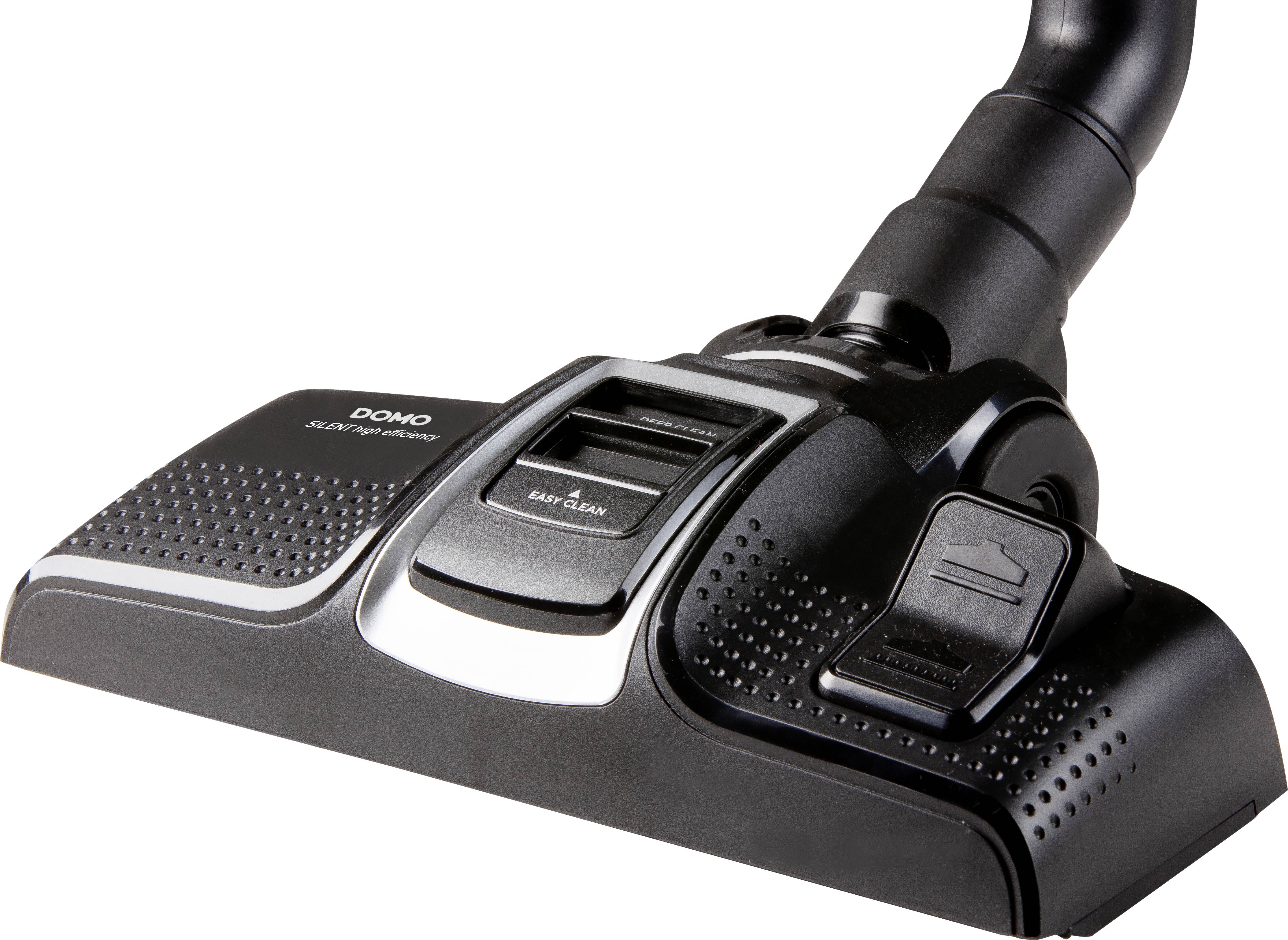 Une tête d'aspirateur noire avec divers réglages et un levier pour le nettoyage des tapis ou des surfaces dures.