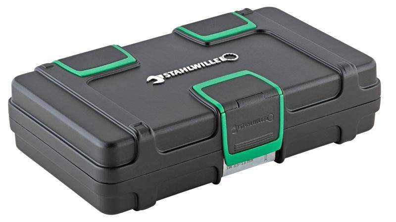 Une mallette à outils noire avec des accents verts et le logo 'Stahlville' sur le couvercle.