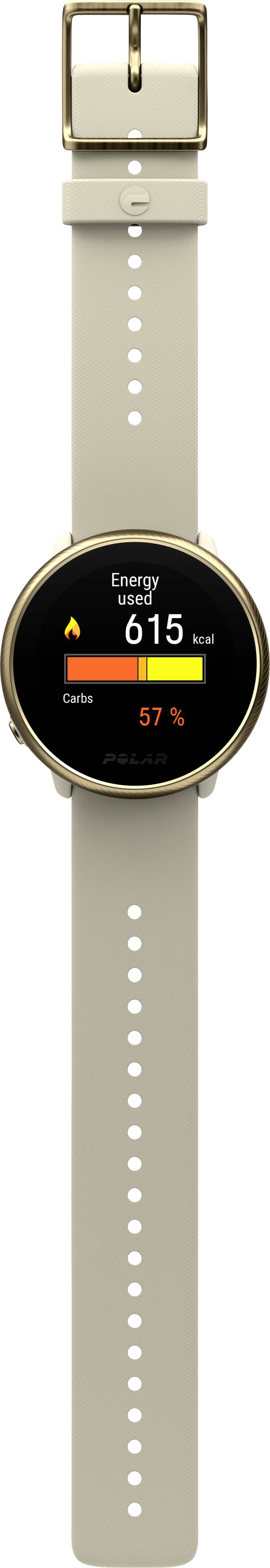 Une montre connectée avec un bracelet beige affiche sur son écran 'Énergie' avec 615 kcal et 57 % d'objectif atteint.