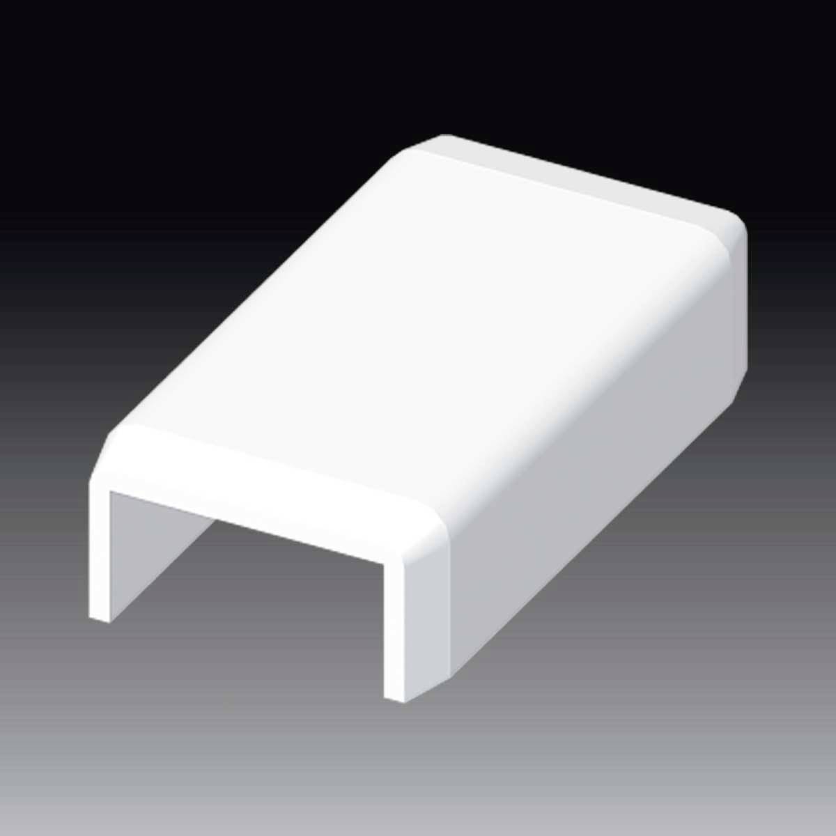 Une puce en céramique blanche et rectangulaire posée sur une surface sombre.