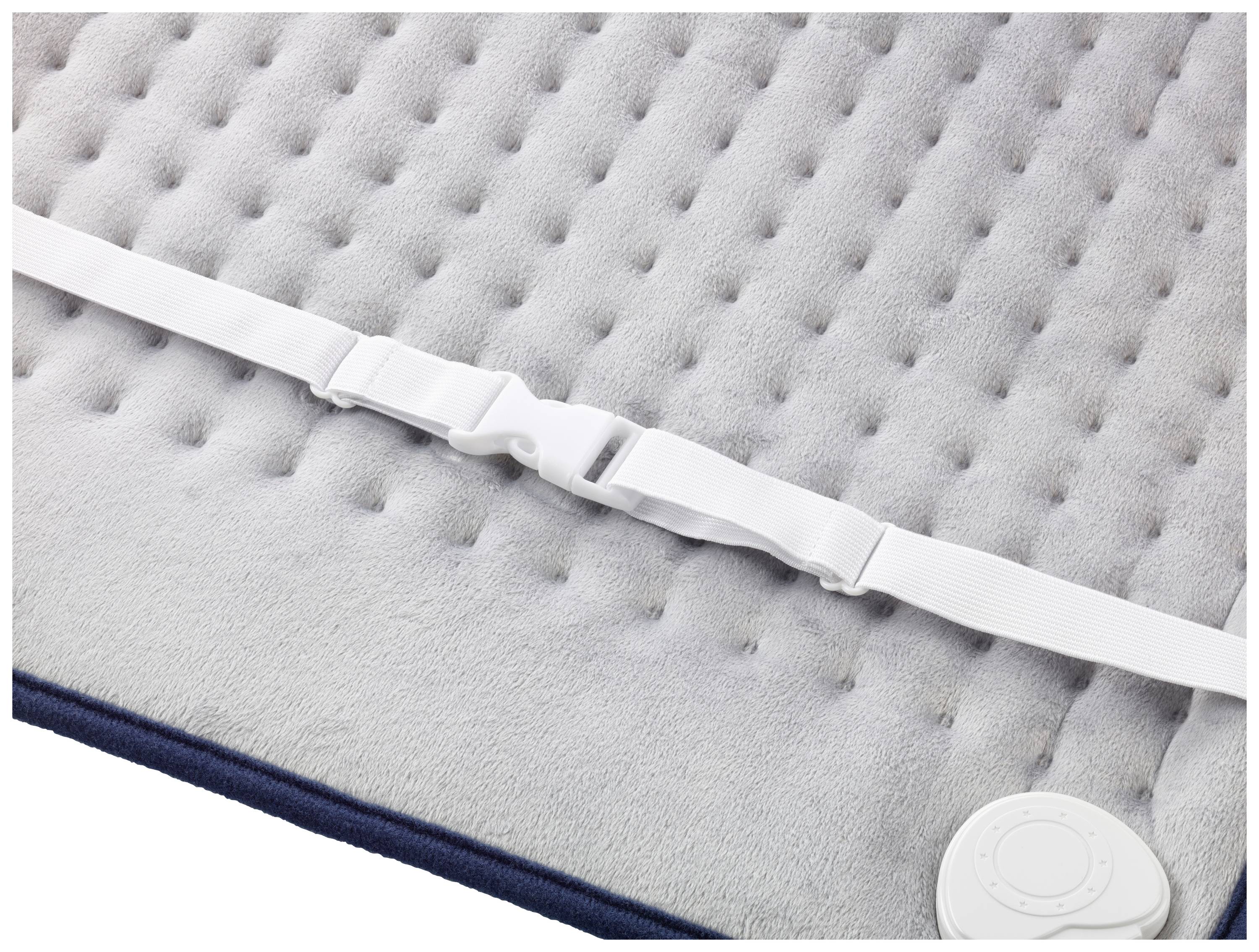 Couverture chauffante électrique au design matelassé, avec une sangle blanche et des commandes. Idéale pour soulager les douleurs musculaires.