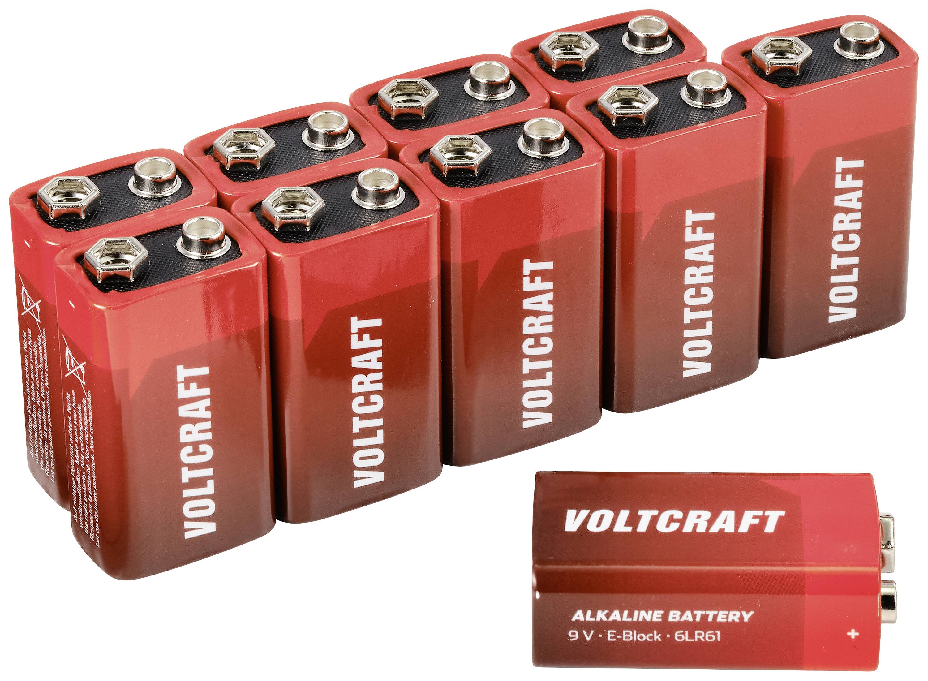 Neuf piles 9 volts rouges de la marque 'Voltcraft', disposées en deux rangées. Une pile unique est placée devant.