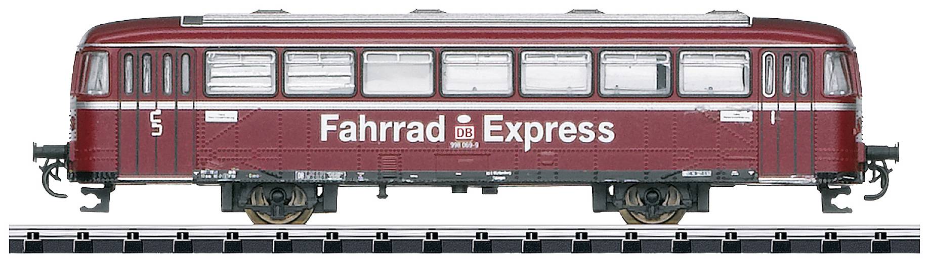 Un train rouge et blanc portant l'inscription 'Fahrrad Express' sur le côté. Le train est stationné sur des rails et possède plusieurs fenêtres.