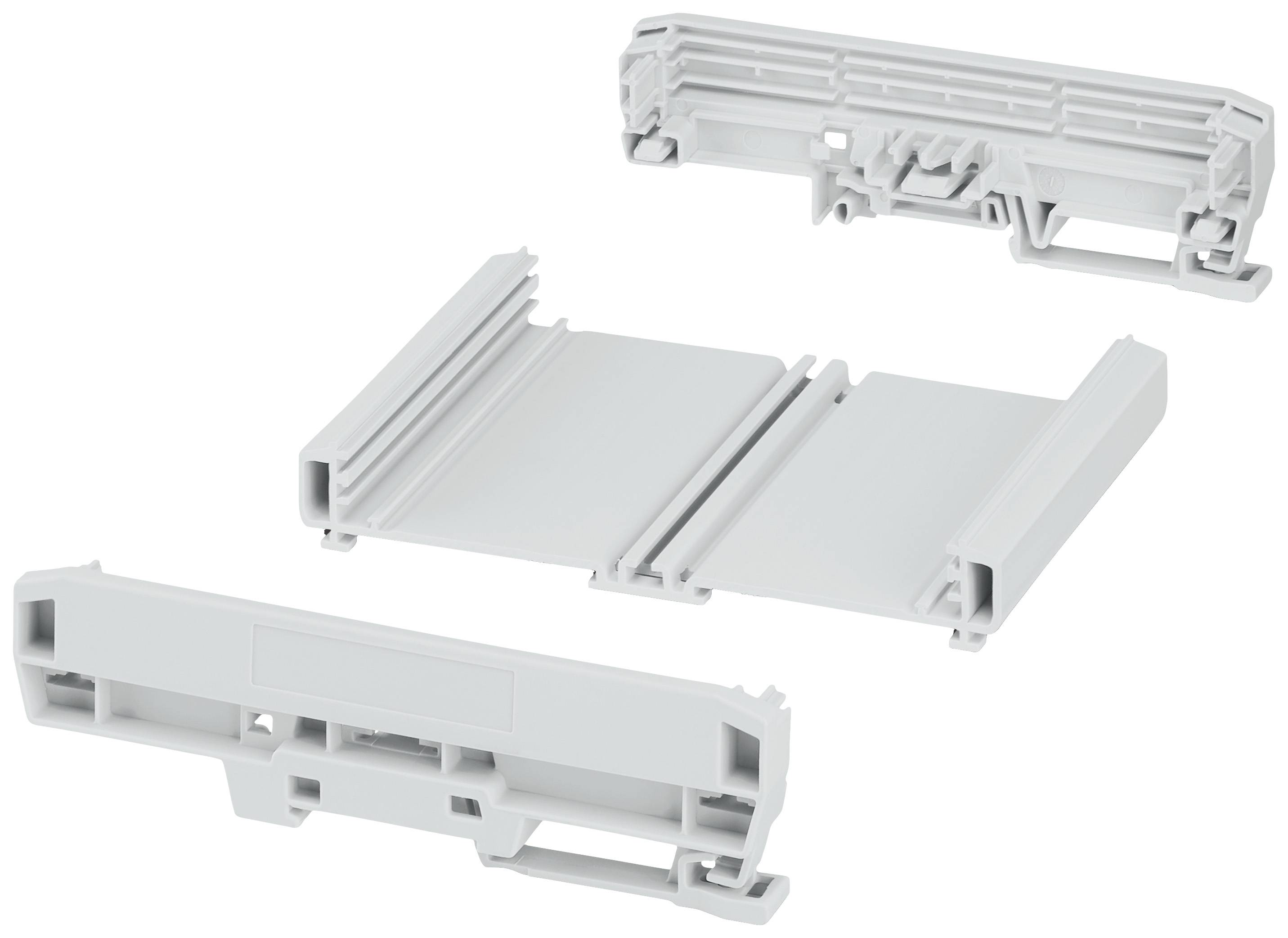 Pièces rectangulaires blanches en plastique, probablement conçues comme supports ou connecteurs, représentées sous trois angles différents.