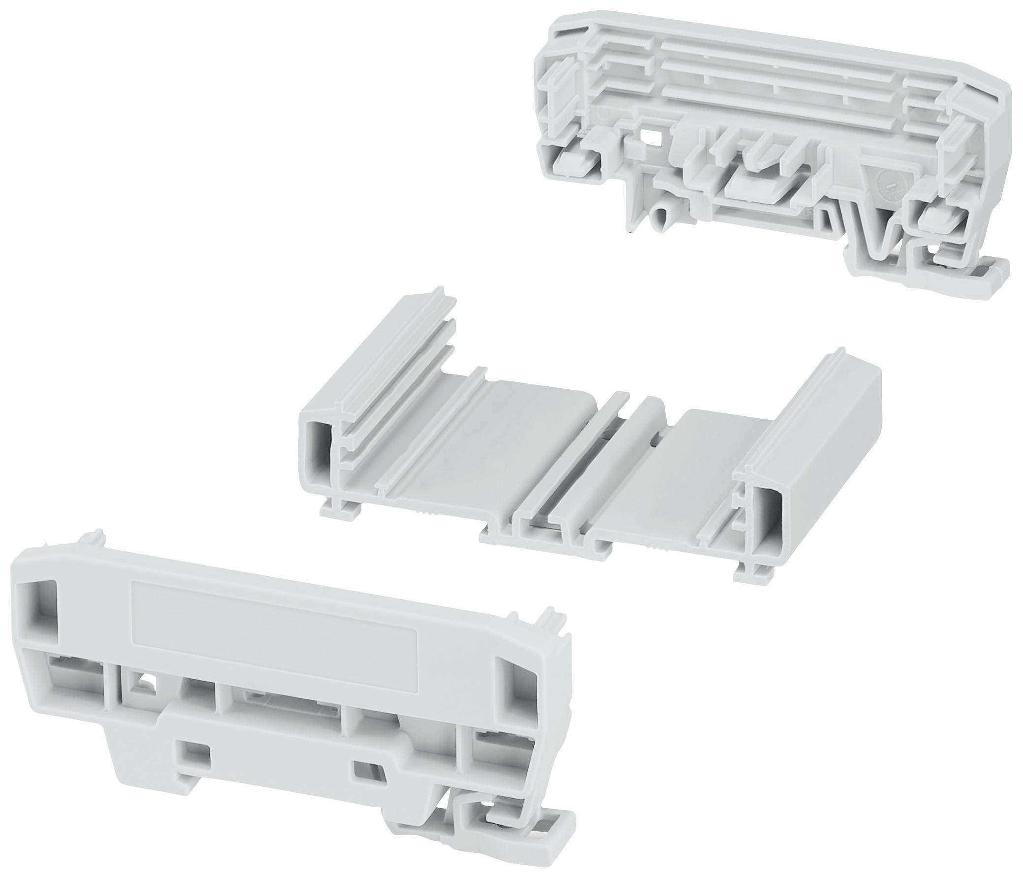 Trois pièces de boîtier en plastique blanc sous différents angles. La partie supérieure montre les structures internes, la partie médiane est ouverte, la partie inférieure présente la face extérieure.