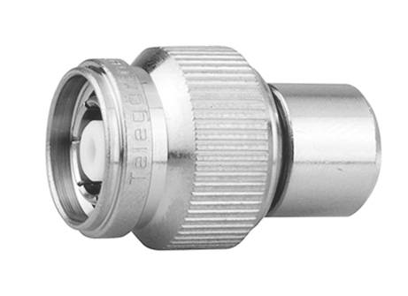 Un connecteur coaxial métallique, de forme compacte, à surface rainurée pour une meilleure prise en main, adapté aux connexions d'antenne.