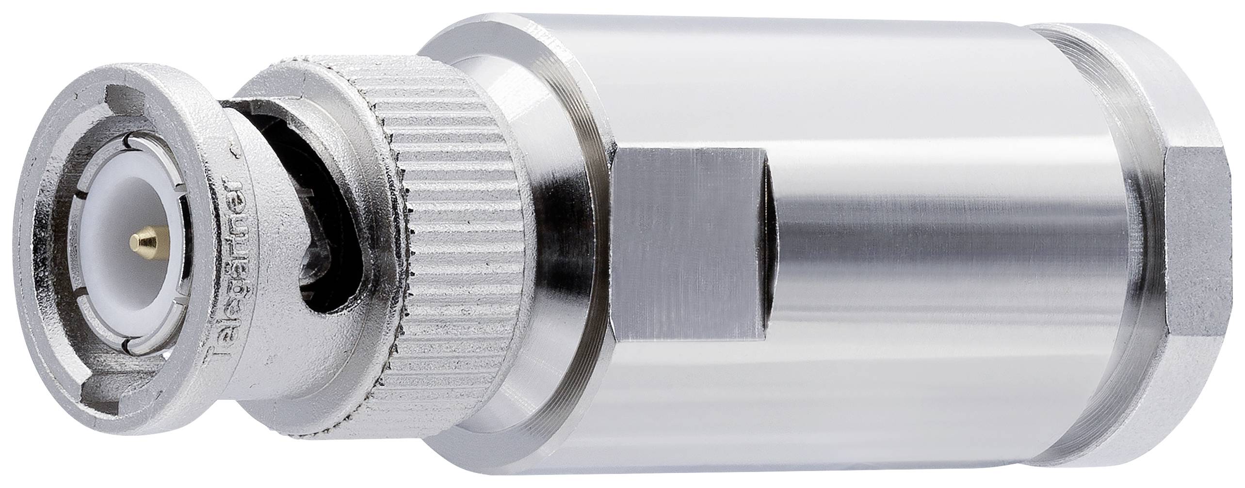 Connecteur coaxial métallique fileté avec broche centrale isolée, posé sur une surface blanche.