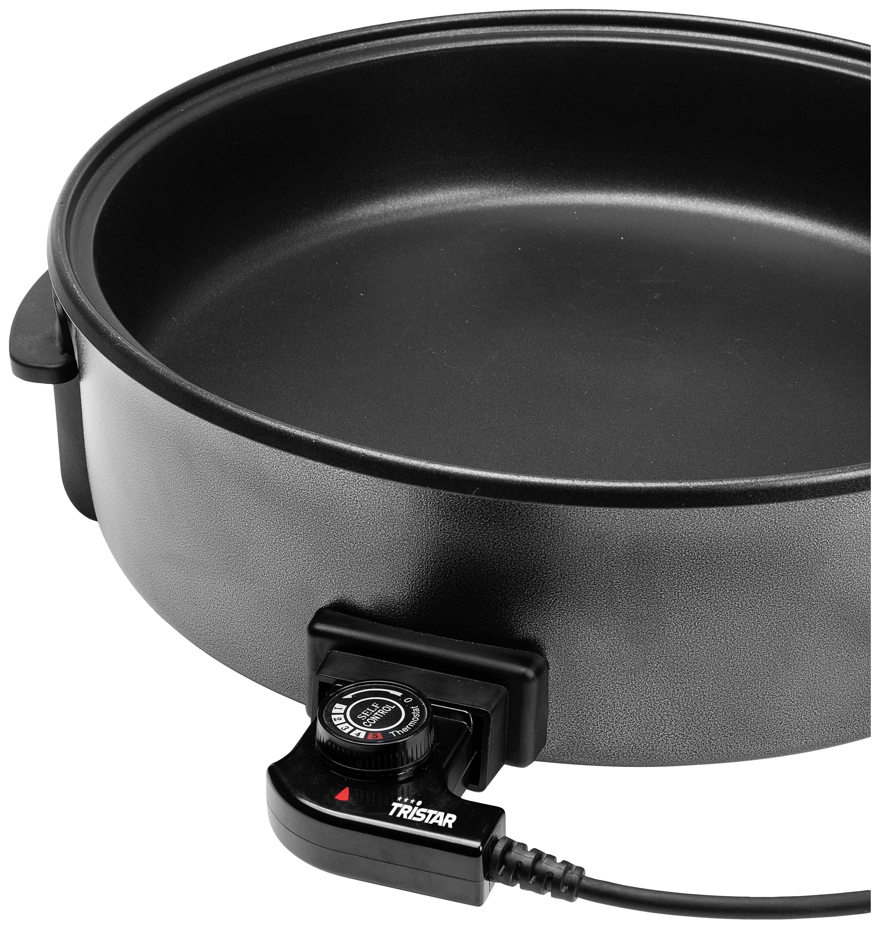 Une poêle électrique ronde équipée d'un régulateur de température. Elle est noire et dispose de poignées sur les côtés.