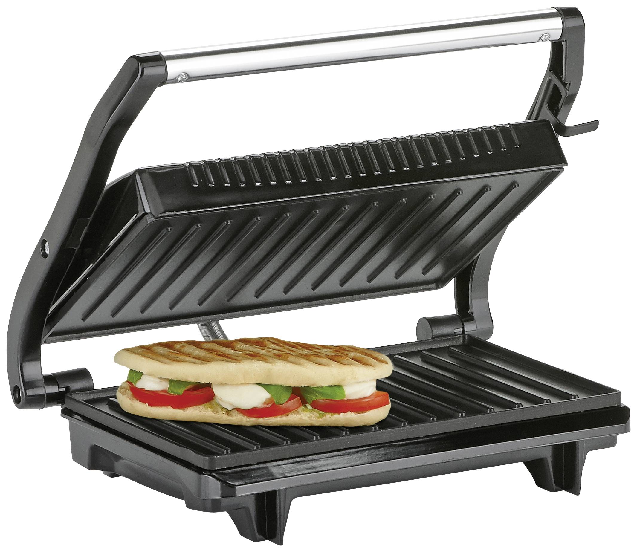 Un appareil de grill électrique à panini avec le couvercle ouvert et un sandwich panini grillé garni de tomates, de mozzarella et de basilic.