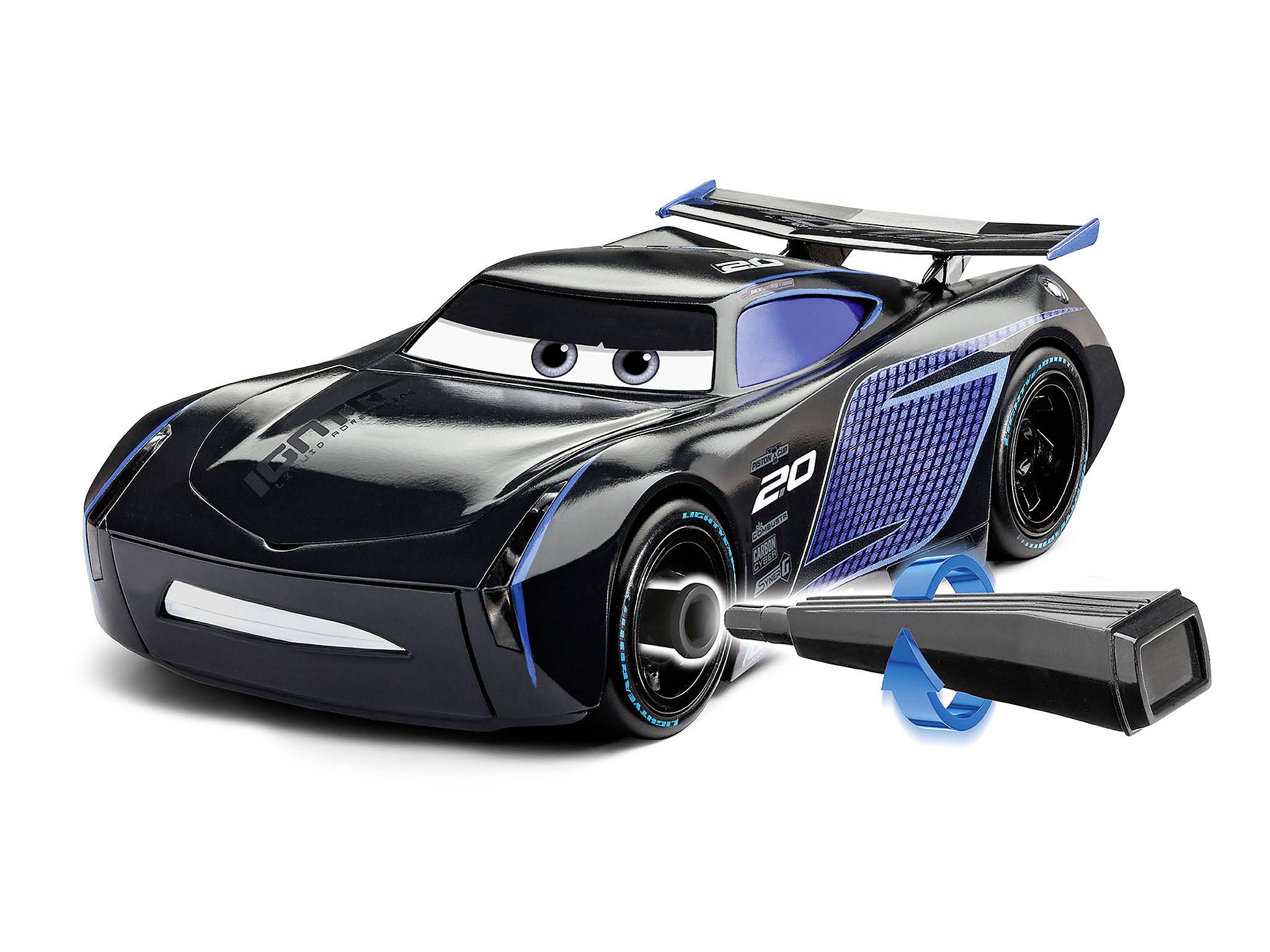Une voiture miniature futuriste bleu-noir avec de grands yeux et un aileron. À côté se trouve une manette noire.