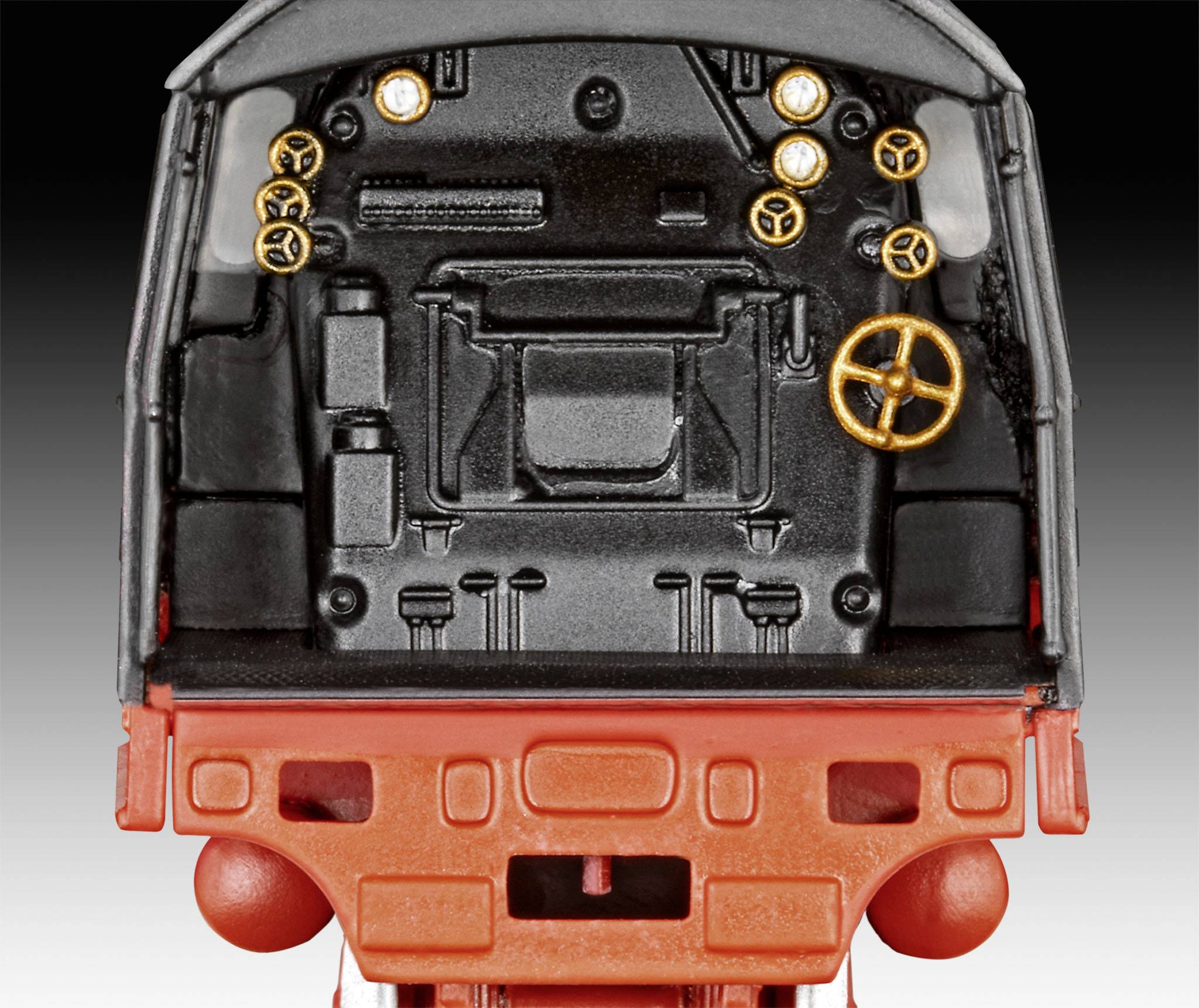 Vue intérieure d'un poste de conduite de train avec plusieurs éléments de commande et indicateurs, principalement en noir et rouge.