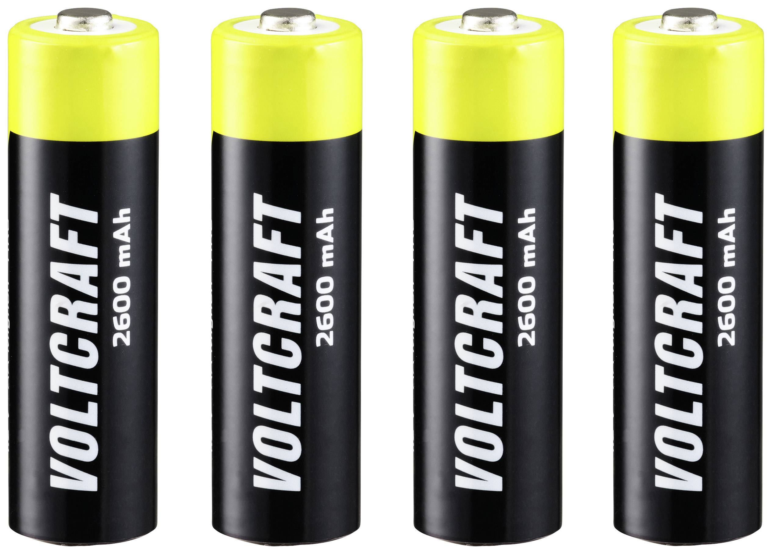 Quatre piles noires avec des embouts jaunes, étiquetées 'VOLTCRAFT 2600 mAh', sont alignées côte à côte.