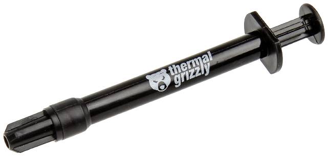 Une seringue noire portant l'inscription 'thermal grizzly', utilisée pour appliquer précisément de la pâte thermique.