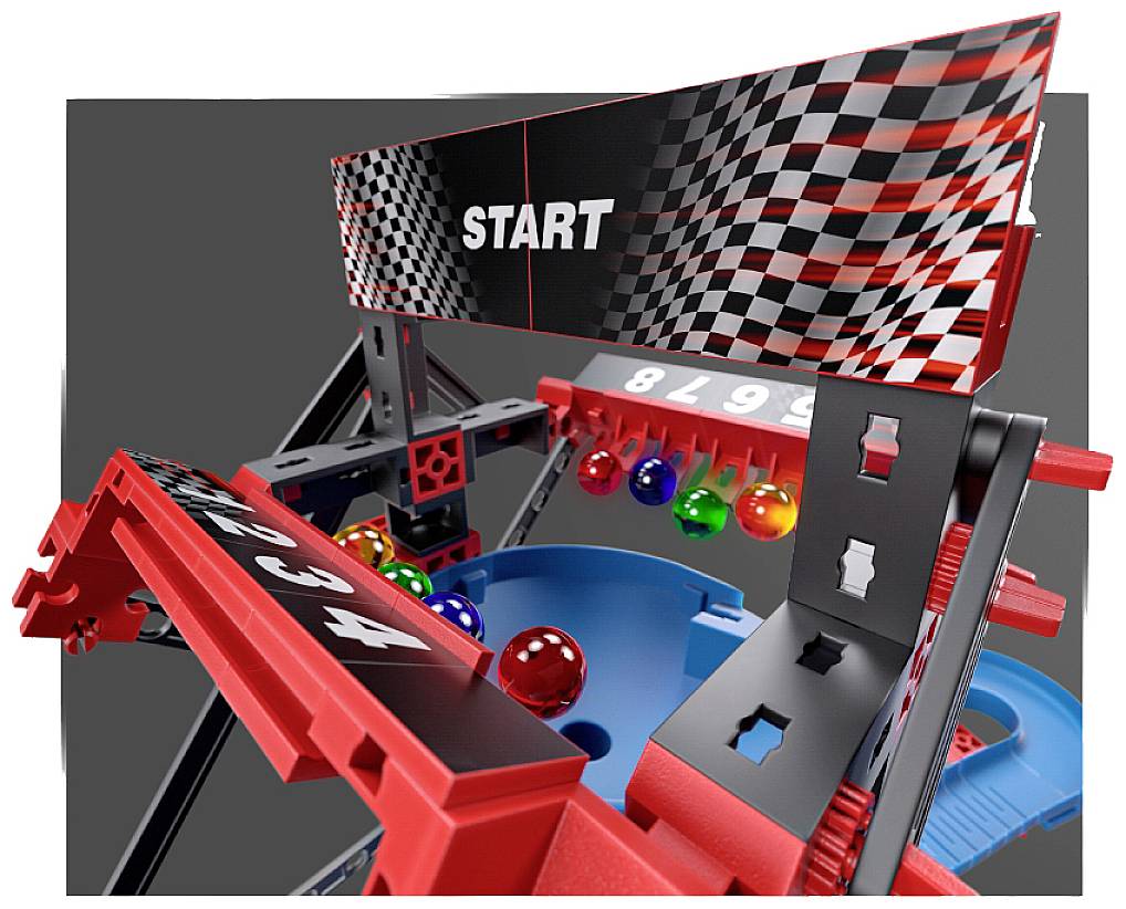 Un jouet avec des boules sur un circuit de course, montré dans une position de départ, avec une ligne de départ à damier noir et blanc.